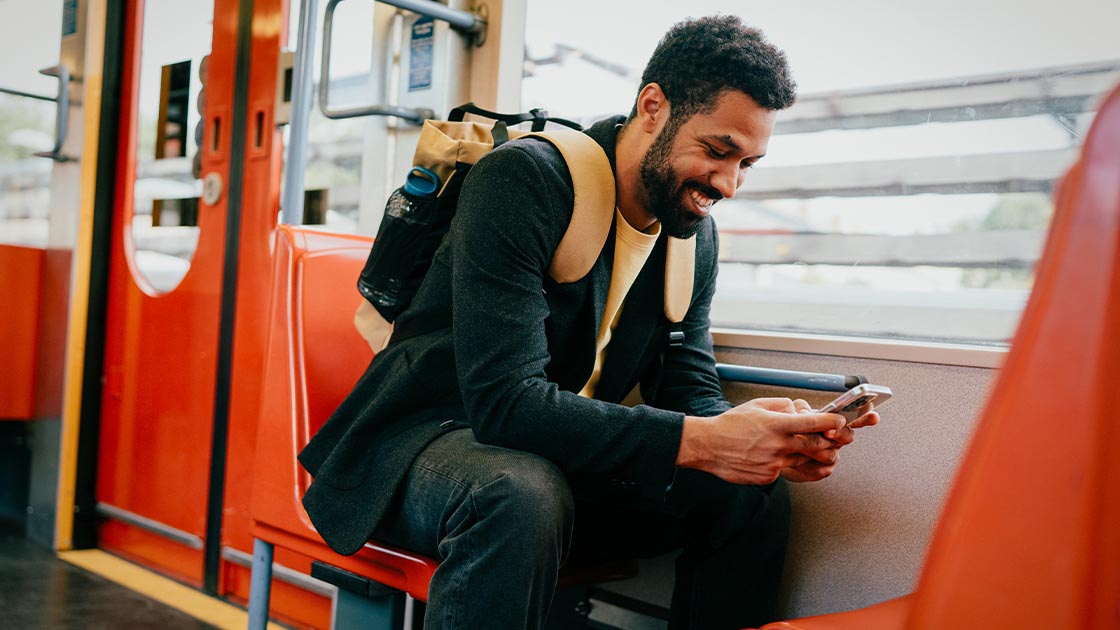 man-laughing-phone-commute-16-9-1120x630px